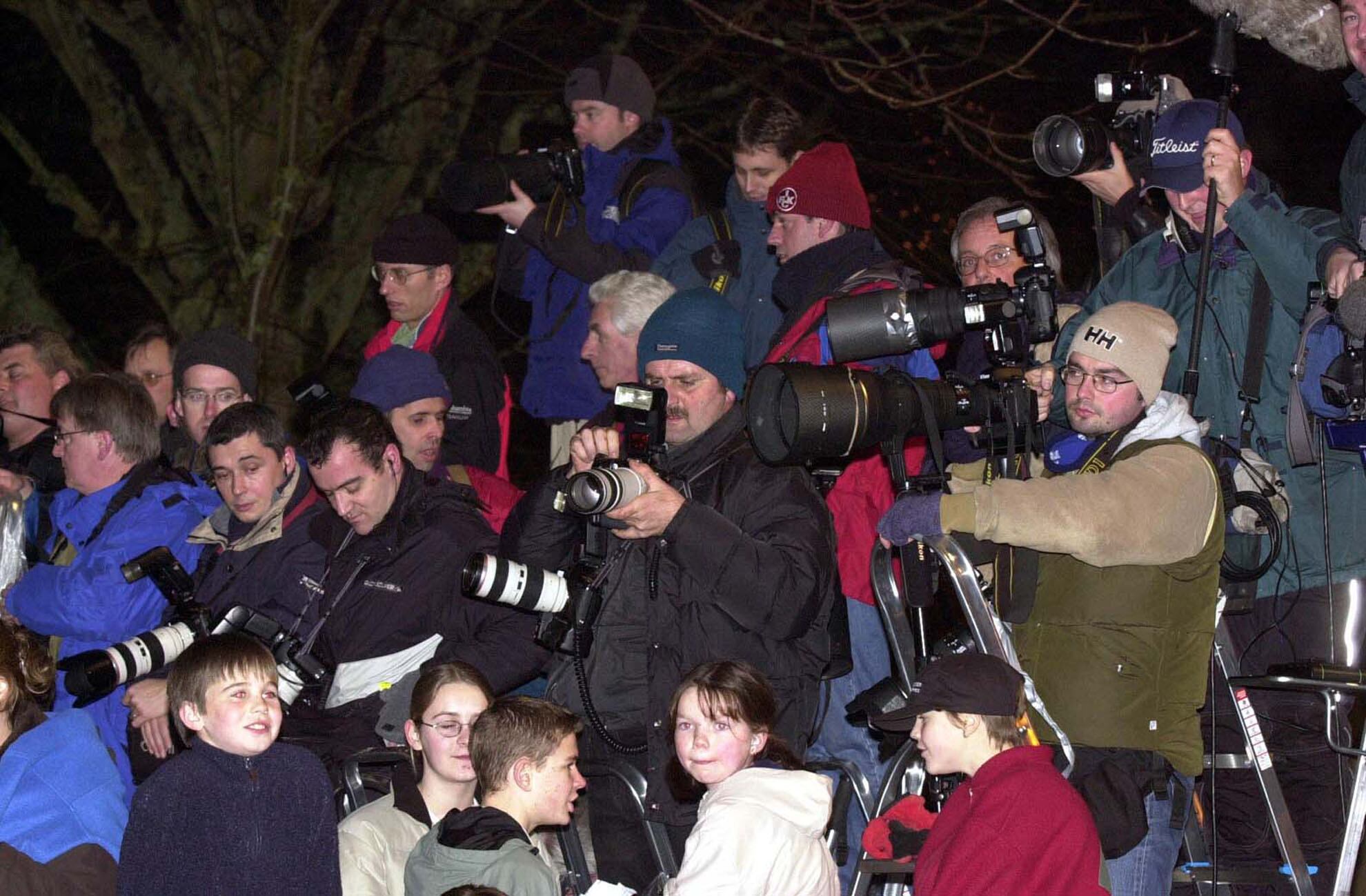 Los fotógrafos en el bautizo de Rocco