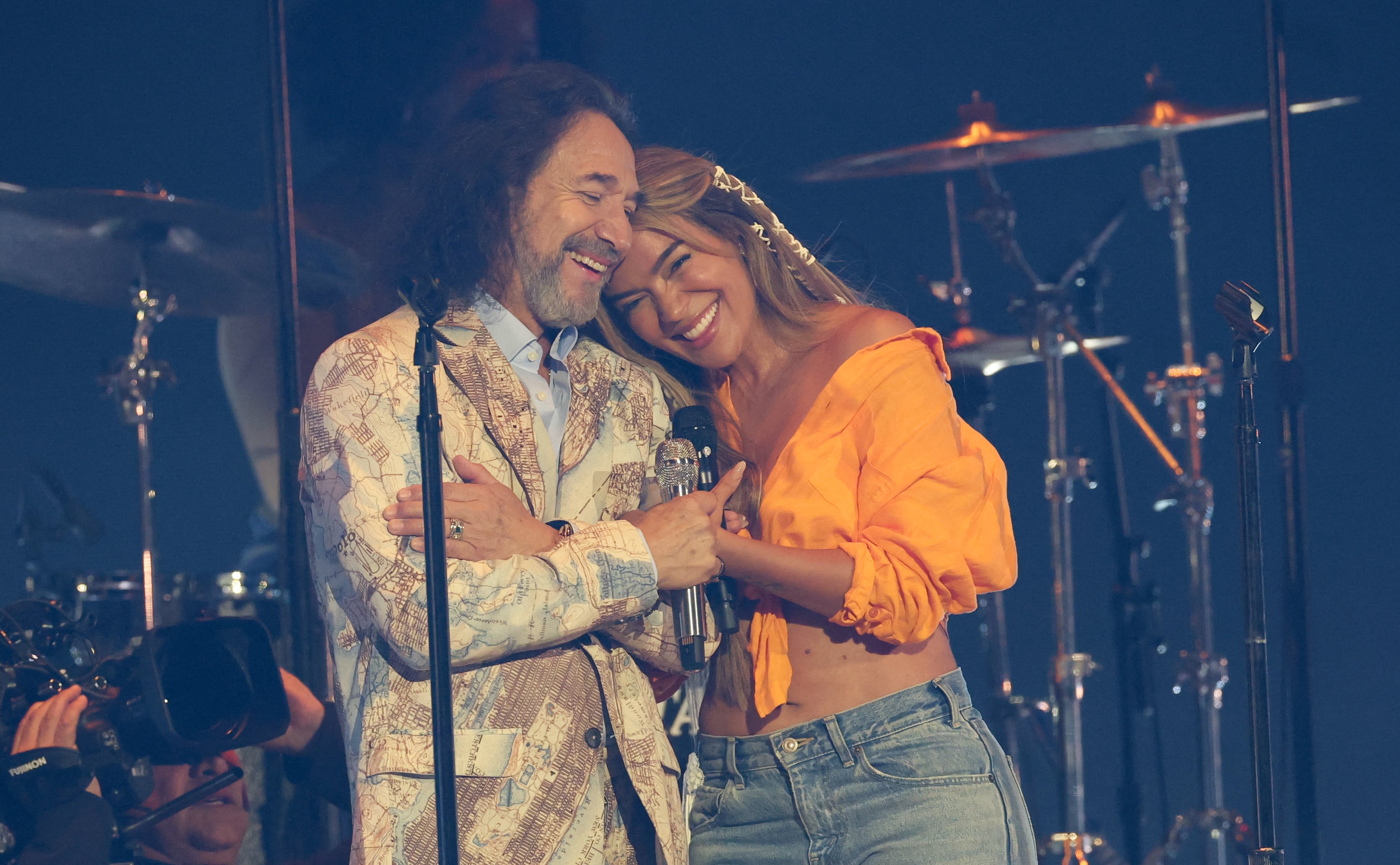 Mexican musician Marco Antonio Solis and Colombian singer-songwriter Karol G perform onstage during the 26th Annual Latin Grammy Awards at the MGM Grand Garden Arena in Las Vegas, Nevada on November 13, 2025. (Photo by VALERIE MACON / AFP) / RESTRICTED TO EDITORIAL USE (Photo by VALERIE MACON/AFP via Getty Images)          