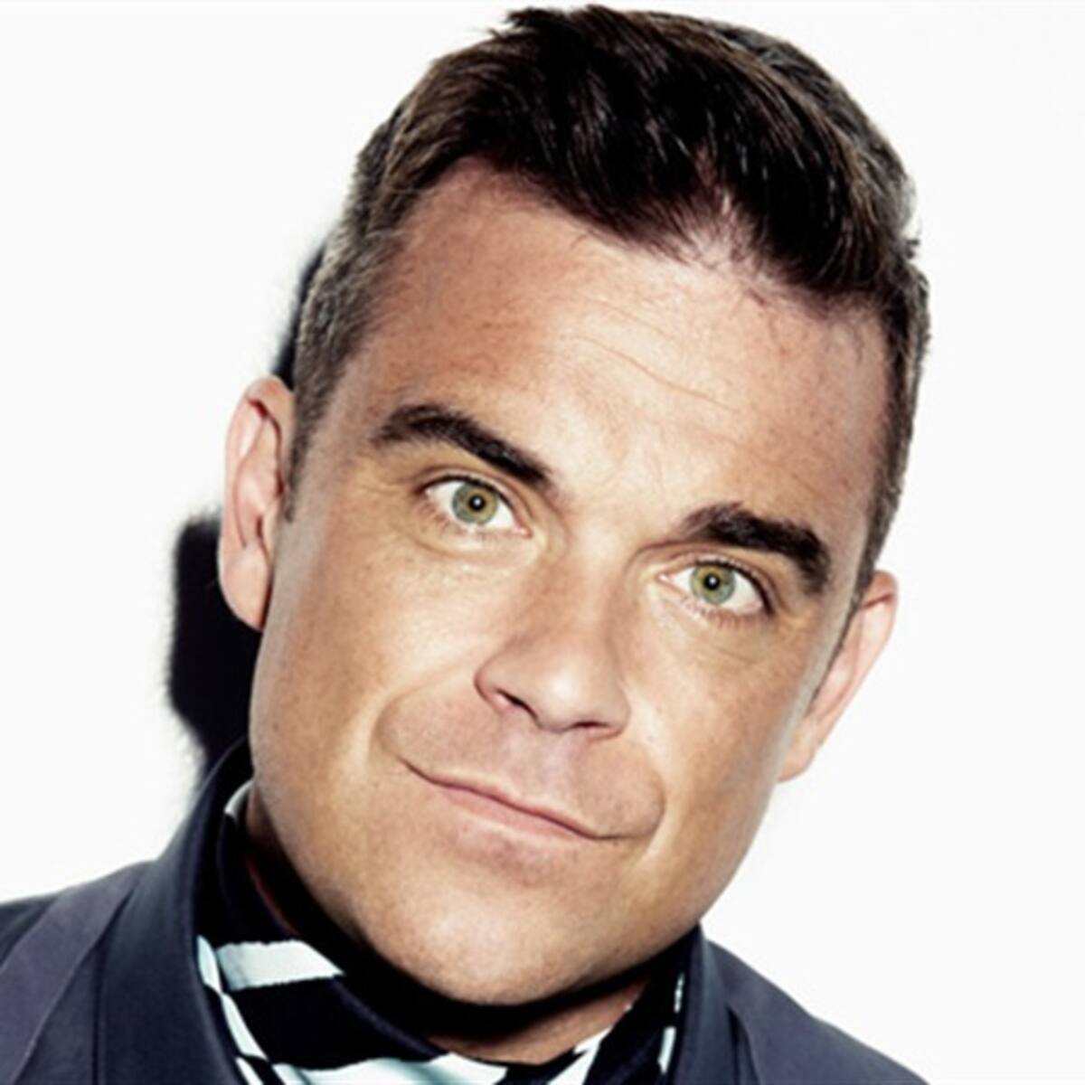 Robbie Williams y One Direction en los Brit Awards