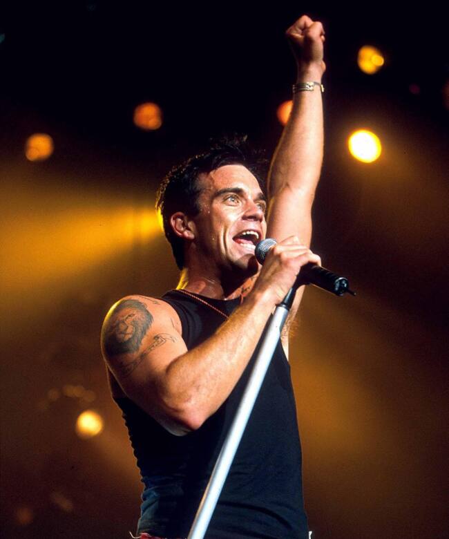 Robbie Williams, en concierto en 2001.