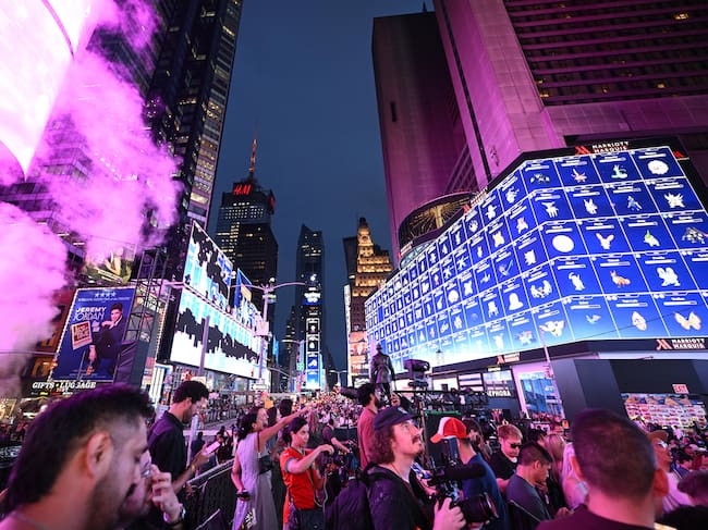 Pokémon GO fans join together in a 1,000 person Raid Battle at the Pokémon GO 10th Anniversary Celebration in Times Square on Thursday, July 9, 2026, in New York. (Carla Torres/AP Content Services for Scopely Explore)