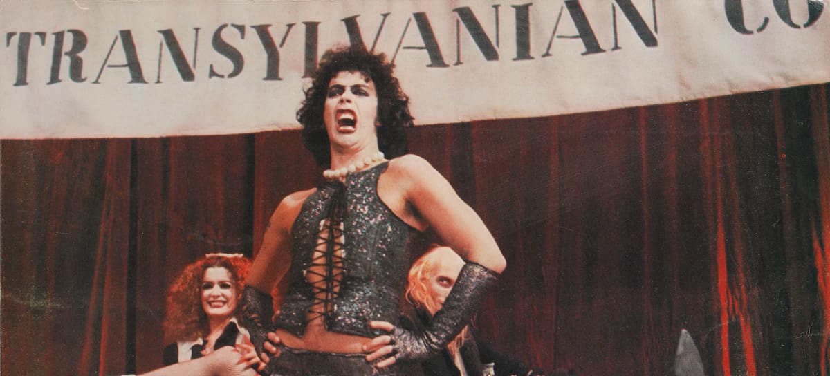 From right to left, actors Richard O'Brien, Tim Curry and Patricia Quinn as Riff Raff, Dr Frank-N-Furter and Magenta respectively, on a lobby card from the 1975 musical comedy 'The Rocky Horror Picture Show', produced by 20th Century Fox. (Photo by Movie Poster Image Art/Getty Images)