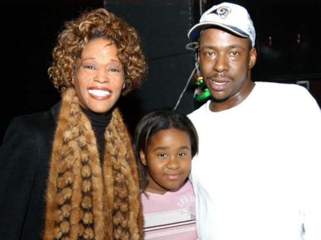 Whitney Houston con su hija, Bobby Kristina, y su marido Bobby Brown.