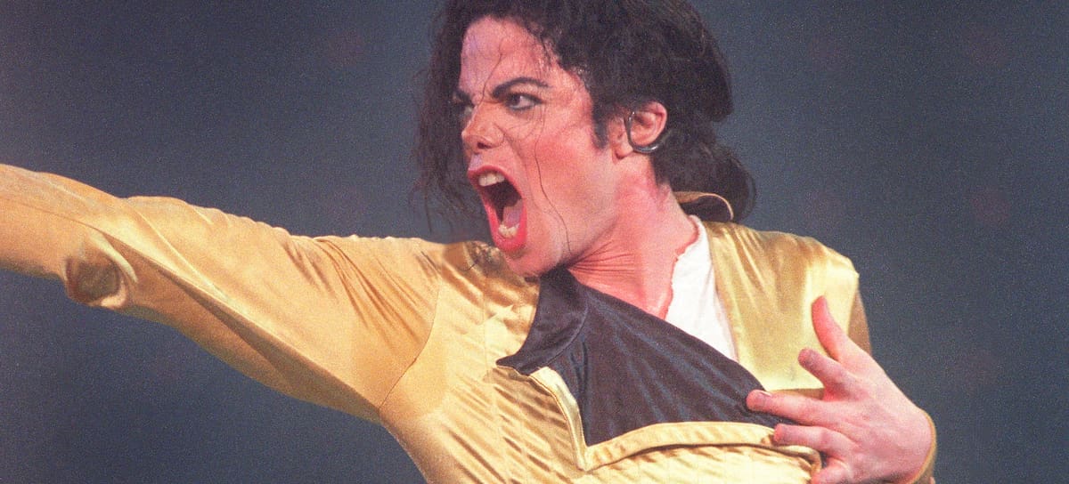 Michael Jackson performs live on stage, 1996. (Photo by Phil Dent/Redferns)