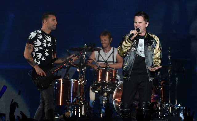 Chris Wolstenholme, Dominic Howard y Matt Bellamy de Muse durante un concierto en Inglewood (California) en 2017.