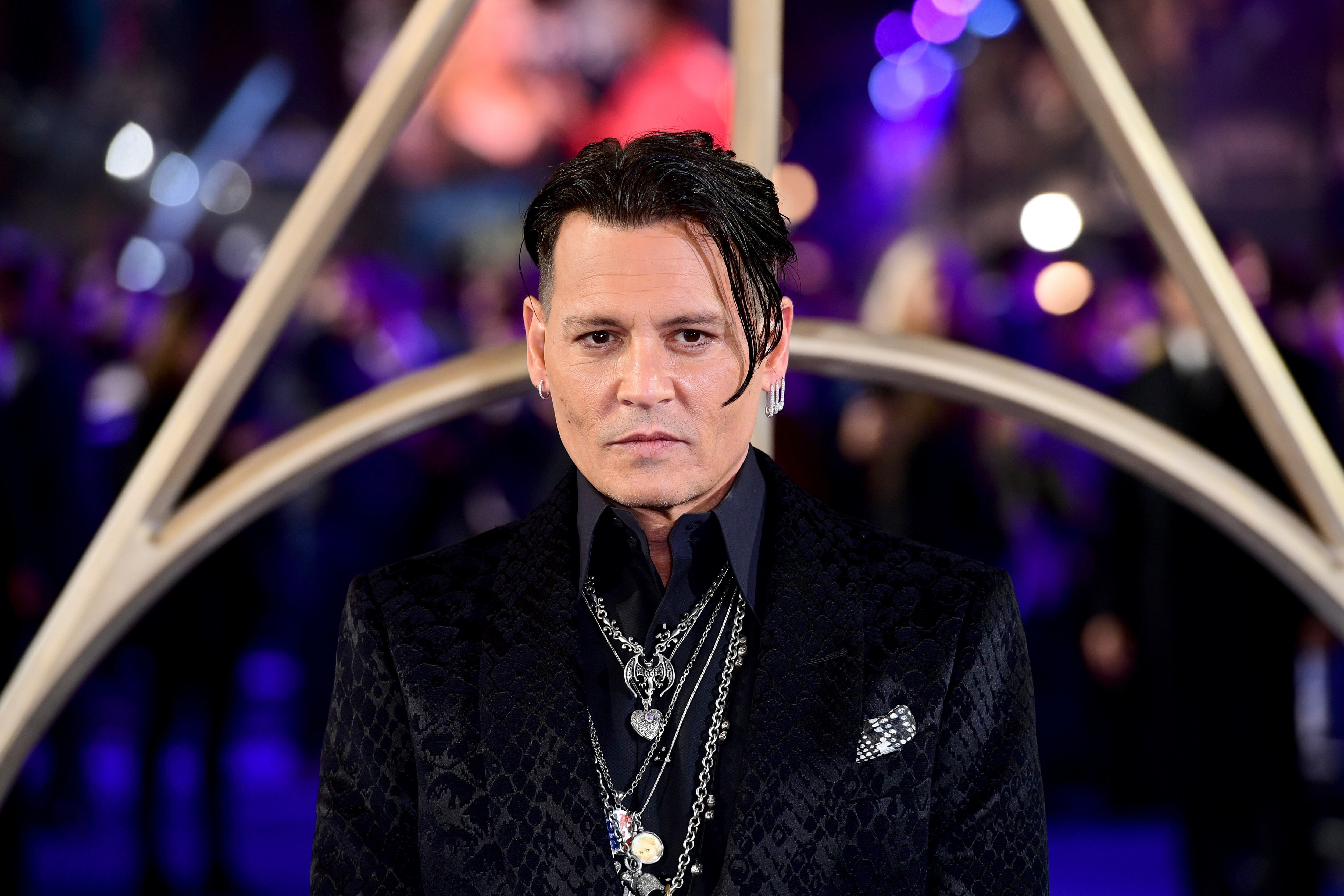 Johnny Depp en la premiere de &#039;Animales Fantásticos: Los Crímenes de Grindelwald&#039; en Londres en 2018. / Ian West/PA Images via Getty