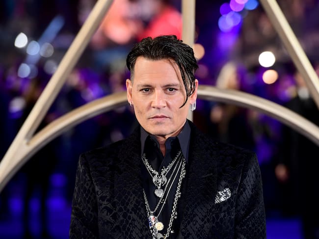 Johnny Depp en la premiere de 'Animales Fantásticos: Los Crímenes de Grindelwald' en Londres en 2018. / Ian West/PA Images via Getty